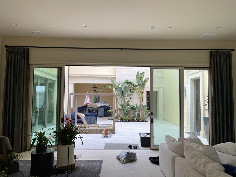 Side panels stacked clear as the sliding doors open to the courtyard