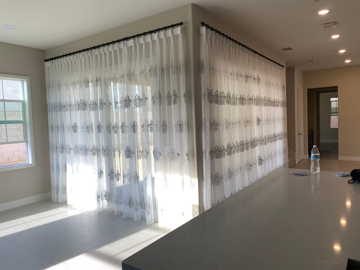 Embroidered Sheers Wrap a Corner Window