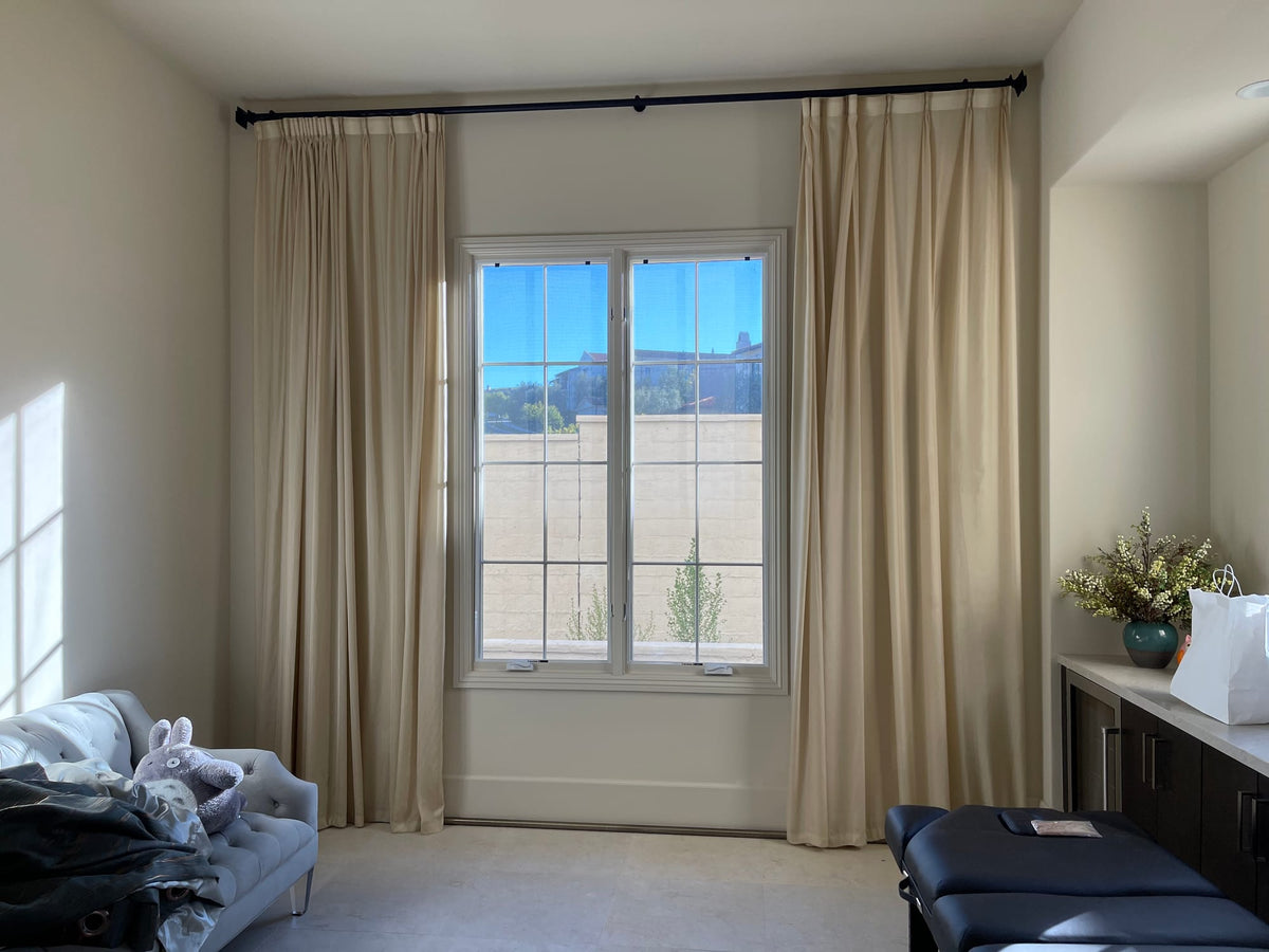 Warm Light Behind Cream Drapery
