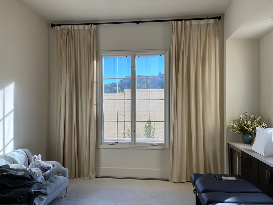 Warm Light Behind Cream Drapery